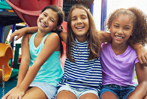 Fotografie Playground, children and girls with portrait for support, summer break and relax together for bonding