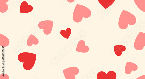A pattern of red and pink hearts on a cream background.