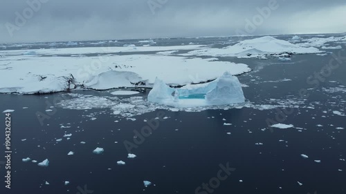 Huge iceberg in Antarctica, aerial drone view on sunny winter day