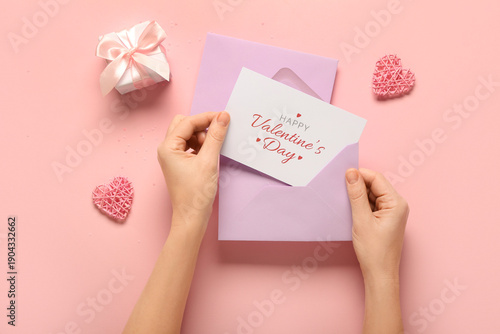 Female hands holding card w...