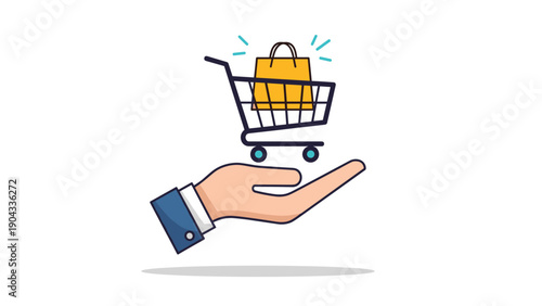 Hand in a business suit sleeve holds up a miniature shopping cart containing a yellow shopping bag to symbolize retail and e-commerce.