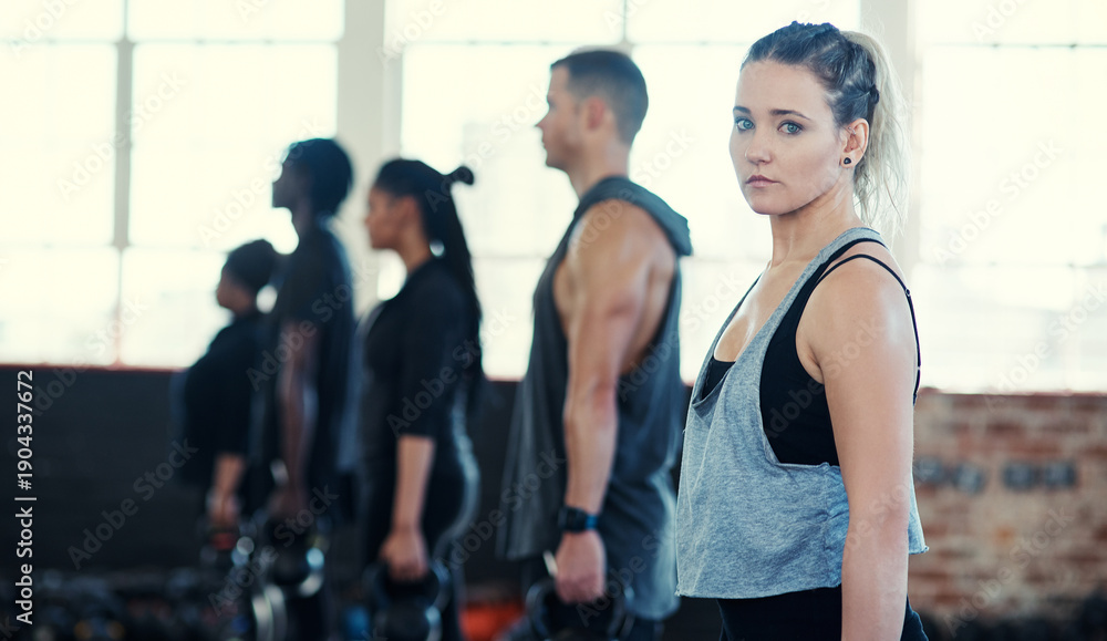 Fototapeta premium Fitness, portrait and woman in gym for exercise, training or wellness with performance progress. Health, serious and female athlete in sports center with challenge, workout or active for weightloss.