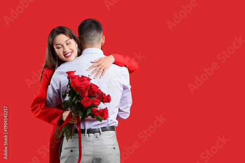 Young woman with bouquet of...