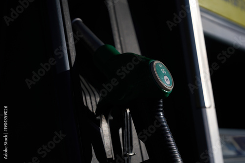 Fuel pump nozzle offering unleaded petrol service price rise gas crisis