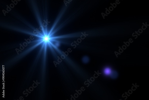 Blue optical lens flare light effect with starburst on black background.