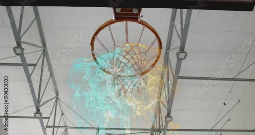 Showing basketball rim and net hanging from gymnasium ceiling, with cyan yellow smoke swirling