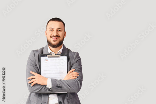 Male real estate agent with...
