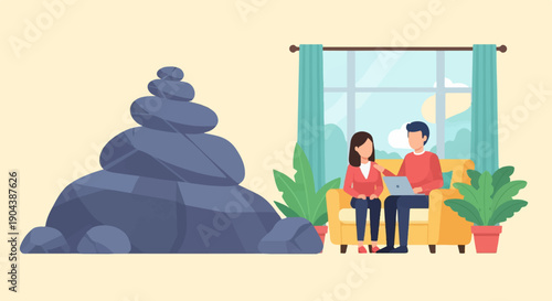 Couple on couch using laptop with stone stack nearby