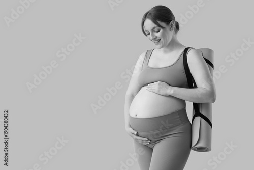 Sporty young pregnant woman...