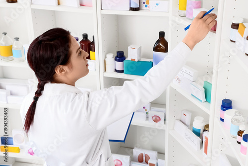 Female pharmacist with clip...