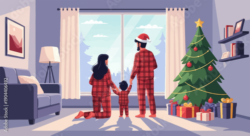Family in matching pajamas by the Christmas tree, looking out window