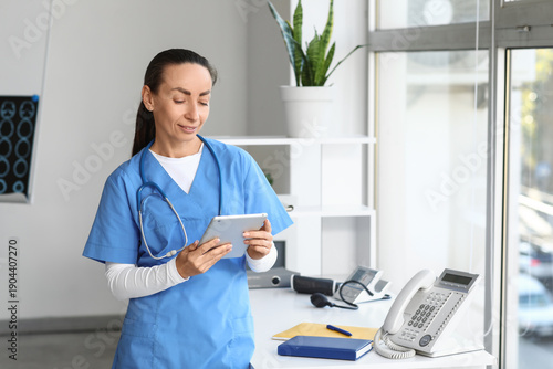 Adult female doctor with ta...