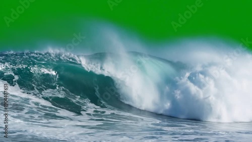 Turquoise ocean wave crashing with white foam, green screen background, for video editing or motion graphics