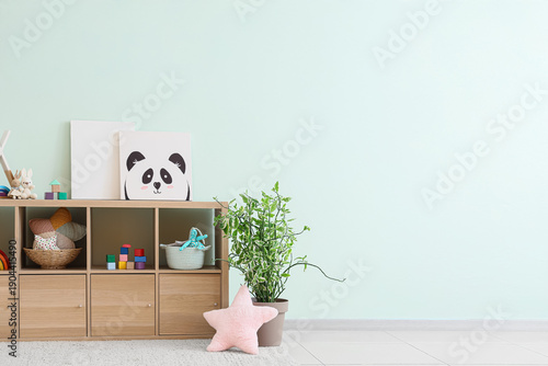 Shelf unit with toys near l...