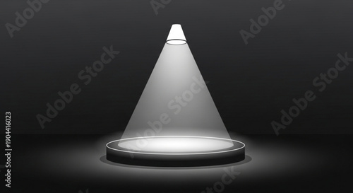 Spotlight shines on empty circular stage in dark room with focused beam of light