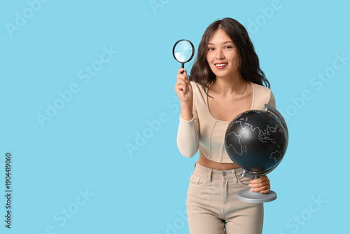 Young Asian woman with glob...