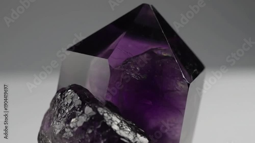 Subtle Dynamic Shifts Gentle camera movements revealing different angles and the interplay of light and shadow on the crystal's surface.