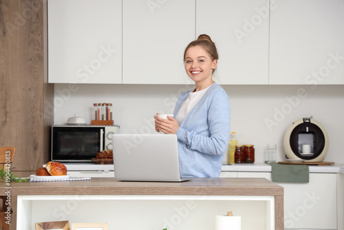 Young woman with cup of cof...
