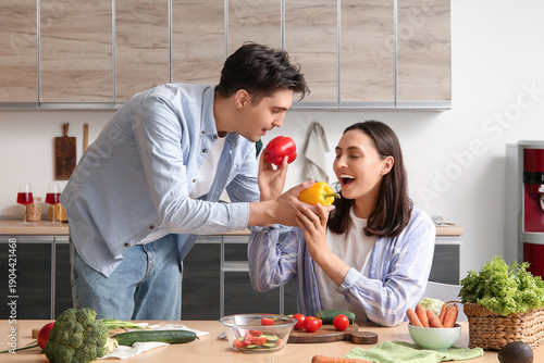 Happy young couple preparin...