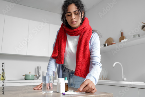 Sick African-American woman...