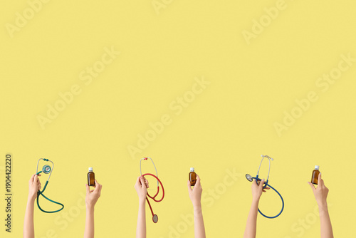 Hands with stethoscopes and...