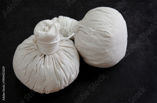 Herbal compress ball and Thai herbs for aromatherapy massage, Thai massage, traditional massage, Traditional herbal compresses are wrapped in natural cloth.