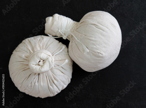 Herbal compress ball and Thai herbs for aromatherapy massage, Thai massage, traditional massage, Traditional herbal compresses are wrapped in natural cloth.