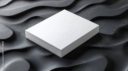 Clean blank paper stack with modern black background, perfect for branding, mockups, stationery design, or professional print concepts.