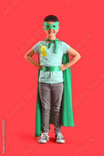 Little boy dressed as super...