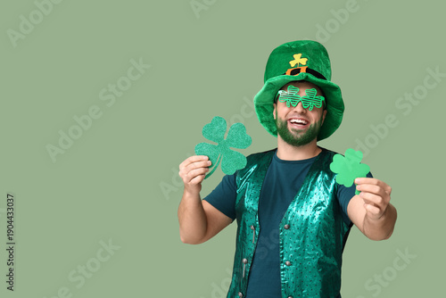 Young man in leprechaun hat...