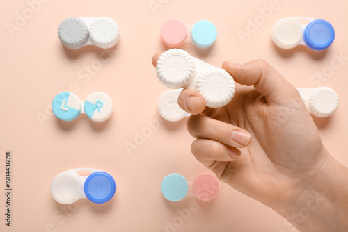 Female hand with containers...