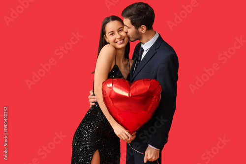 Young man kissing his girlf...
