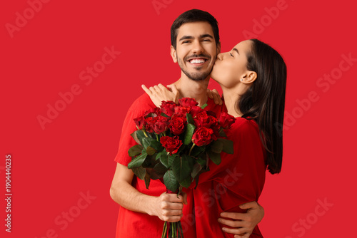 Young woman kissing her boy...