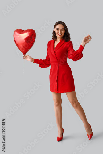 Happy young woman with hear...