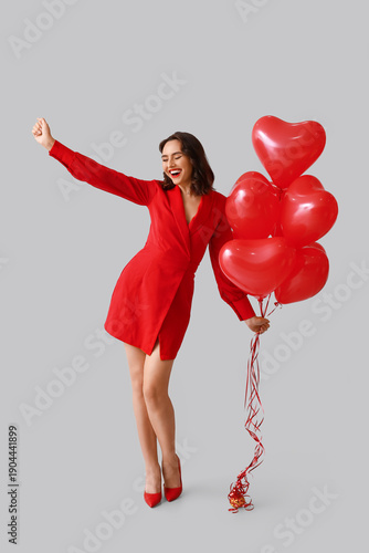 Happy young woman with hear...