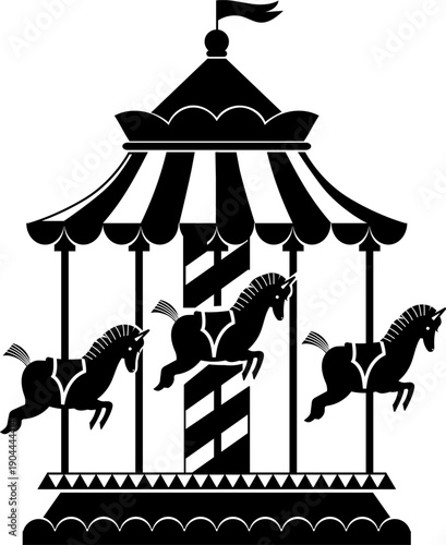 Carousel horses silhouette spinning on amusement park ride