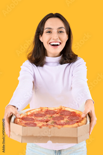 Young woman with tasty pepp...