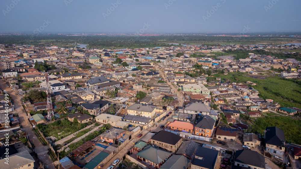 Fototapeta premium lush green vegetation scattered in-between urban civilization.