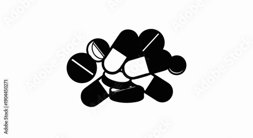 A pile of black and white pills and capsules