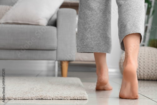 Barefoot woman with floor h...