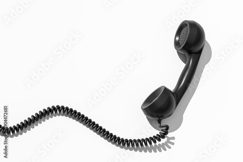 Retro telephone handset with curled wire forming a wave pattern isolated on white background as a communication concept idea in 3D rendering. 3D Rendering