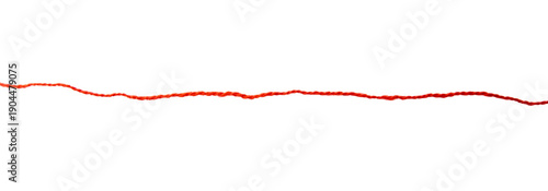Red thread isolate on white background. Selective focus. Old.