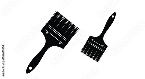 Two black paintbrushes displayed at different angles on a white background