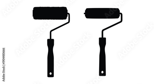 Two black paint rollers with handles isolated on a white background