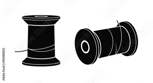 Two black and white spools of thread a simple graphic illustration