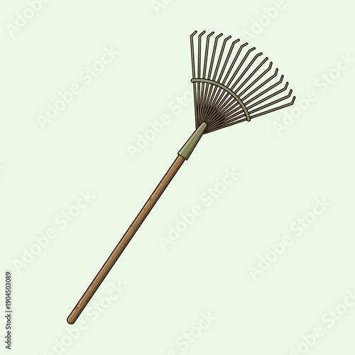 Garden rake, tool for yard work, isolated on light green background.