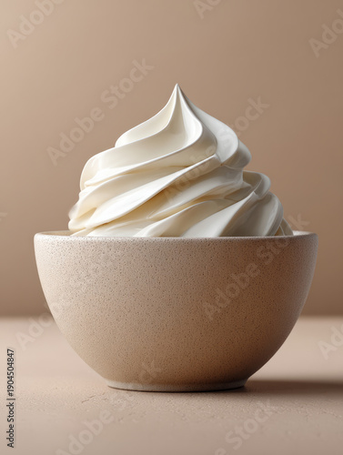 Creamy vanilla soft serve ice cream in minimalist bowl