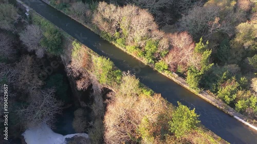 Aerial View Of Ponte Peon - Historic Stone Aqueduct Above San Crimenzo River In Dumbria, Spain. rotating shot