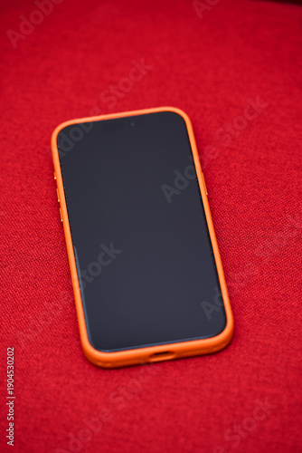 Smartphone on Red Background - Modern Technology