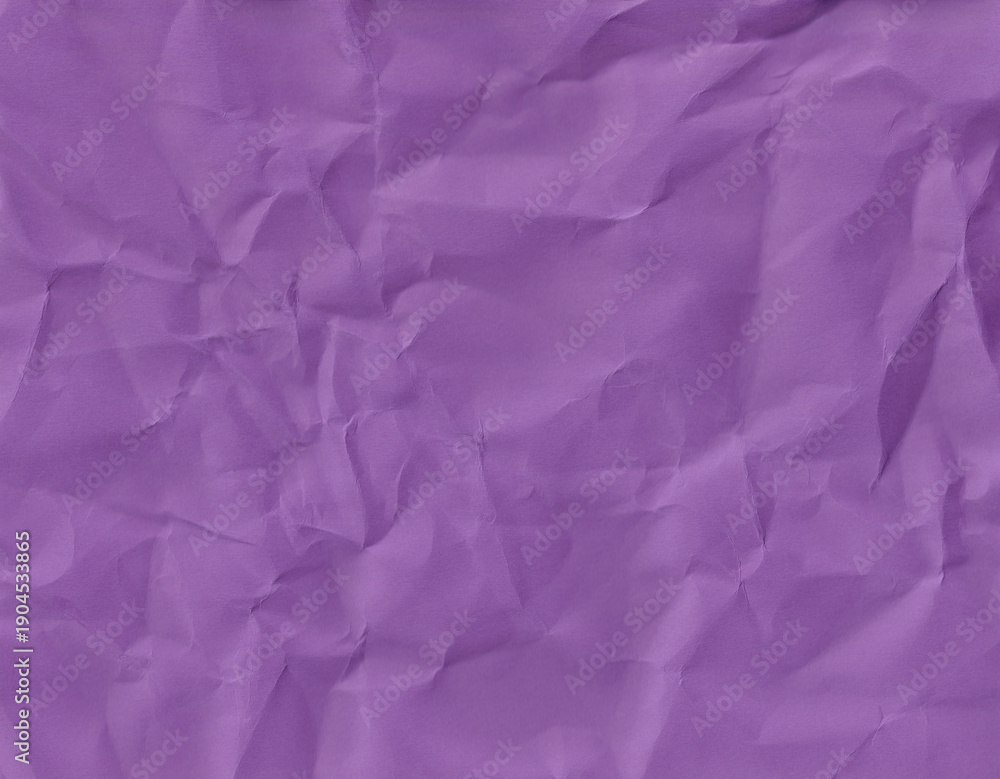 Obraz premium A crumpled purple paper background.Textured purple background with creases and folds shows a simple, colorful design for art and craft projects